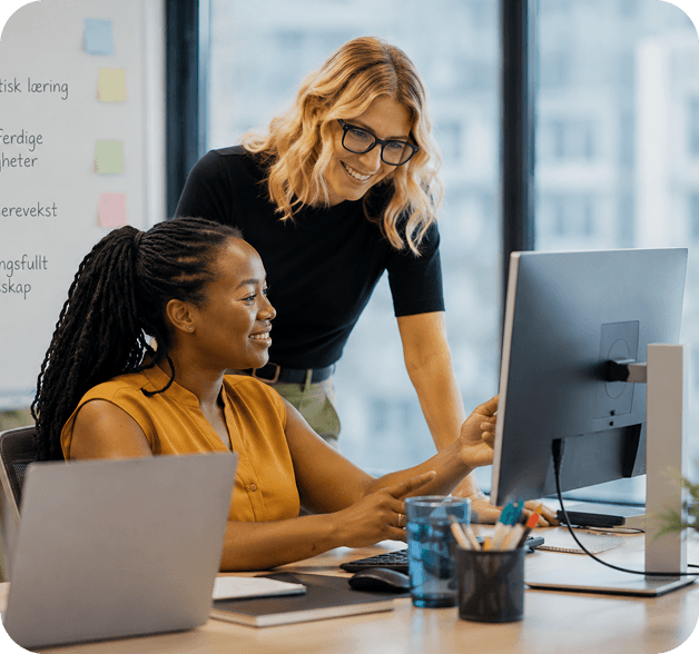 Mentor and candidate collaborating at a computer